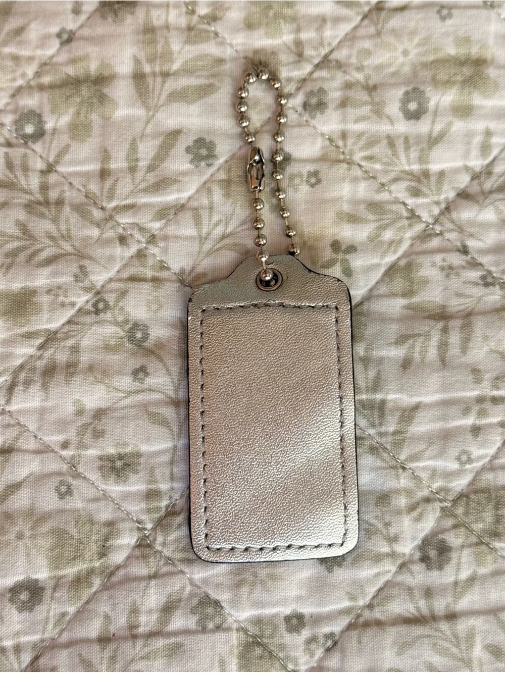 Coach silver metallic hang tag
